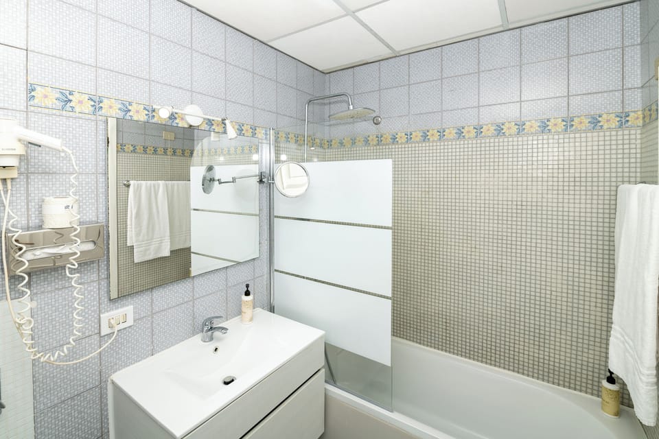 Standard Double Room | Bathroom | Combined shower/tub, deep soaking tub, free toiletries, hair dryer