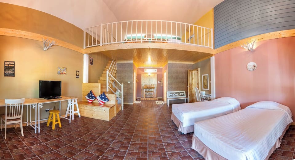 Family Room | Minibar, desk, WiFi (free), bed sheets