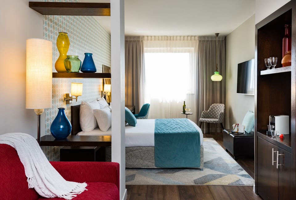 Junior Suite, City View | Living area | LCD TV