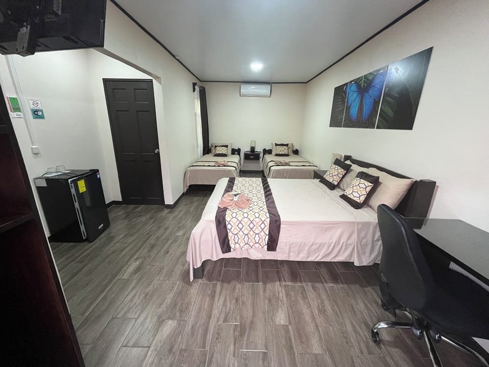 Premium bedding, desk, laptop workspace, blackout drapes