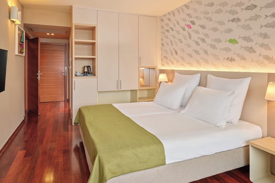 Family Room, Balcony | Minibar, in-room safe, desk, blackout drapes