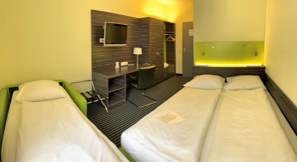 Standard Triple Room | Desk, blackout drapes, soundproofing, free WiFi