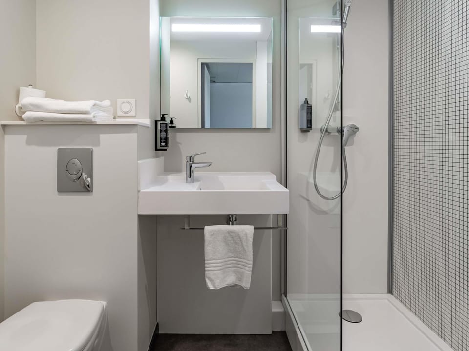 Shower, eco-friendly toiletries, hair dryer, towels