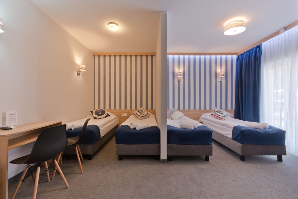 Quadruple Room | Premium bedding, desk, soundproofing, cribs/infant beds