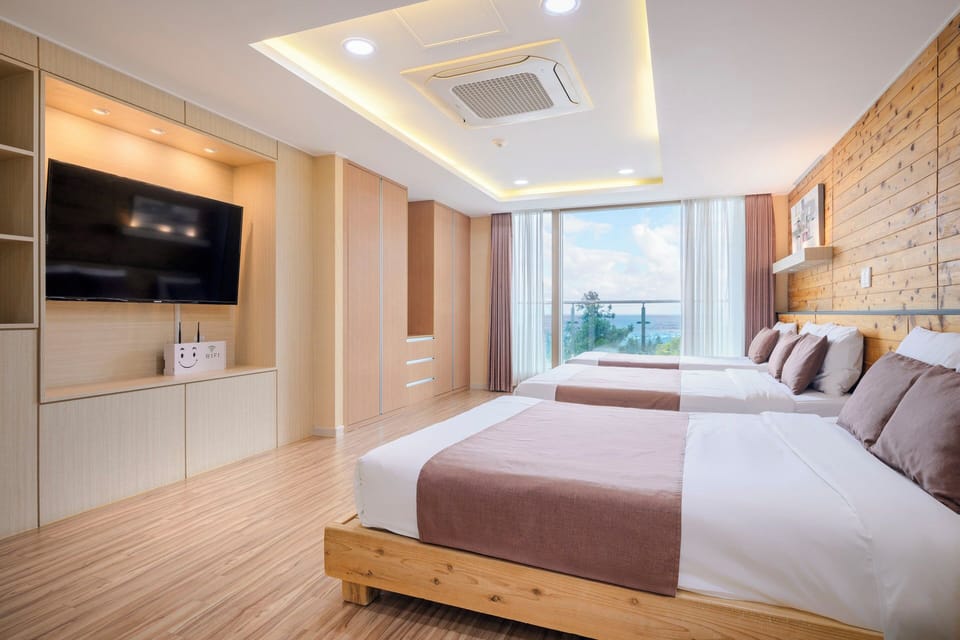 Royal Triple Room, Multiple Beds, Balcony, Partial Ocean View | Premium bedding, blackout drapes, soundproofing, free WiFi