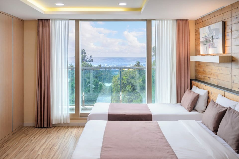 Royal Triple Room, Multiple Beds, Balcony, Partial Ocean View | Premium bedding, blackout drapes, soundproofing, free WiFi