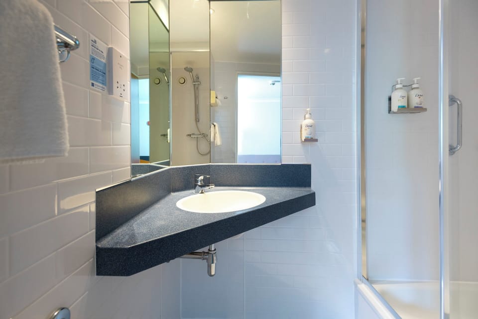 Shower, eco-friendly toiletries, hair dryer, towels