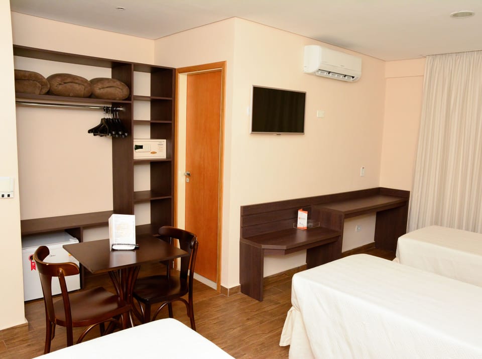 Quadruple Room | Minibar, in-room safe, desk, blackout drapes