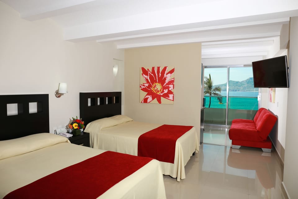 Junior Studio Suite, Kitchenette, Sea View | In-room safe, laptop workspace, iron/ironing board, bed sheets