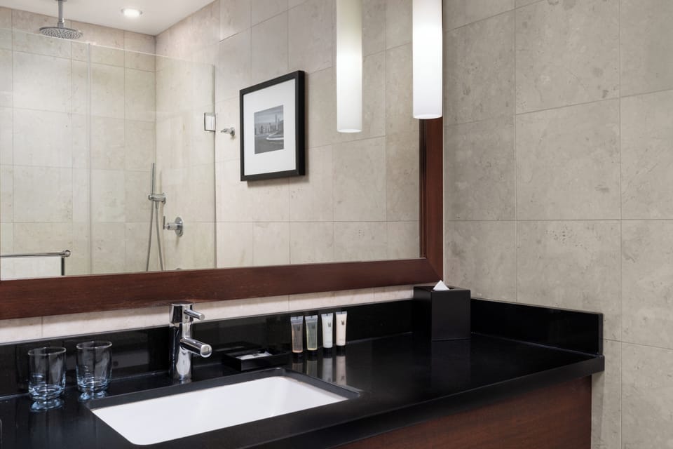 Designer toiletries, hair dryer, bathrobes, slippers