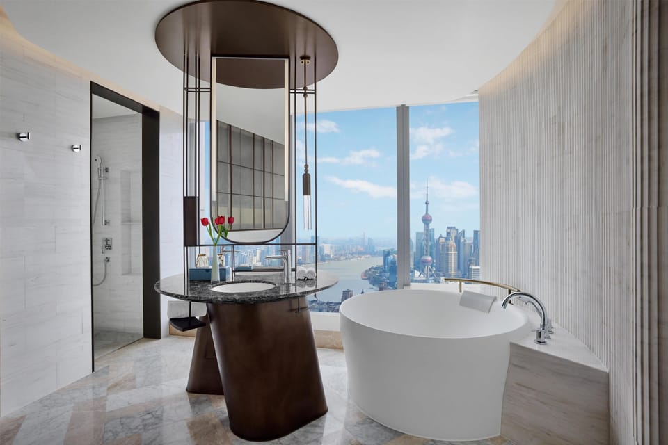 Premium Bund View Suite | Bathroom | Separate tub and shower, rainfall showerhead, designer toiletries