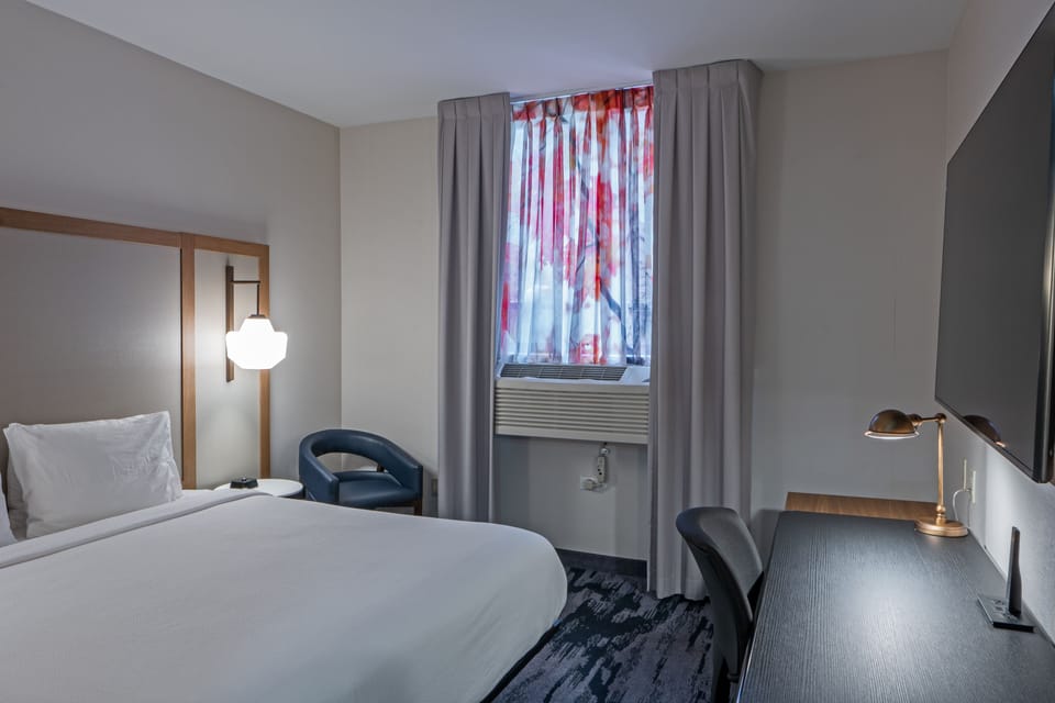 Premium bedding, down comforters, in-room safe, desk