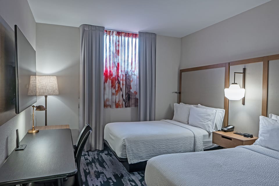 Premium bedding, down comforters, in-room safe, desk