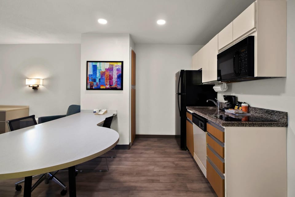 Desk, laptop workspace, blackout drapes, iron/ironing board