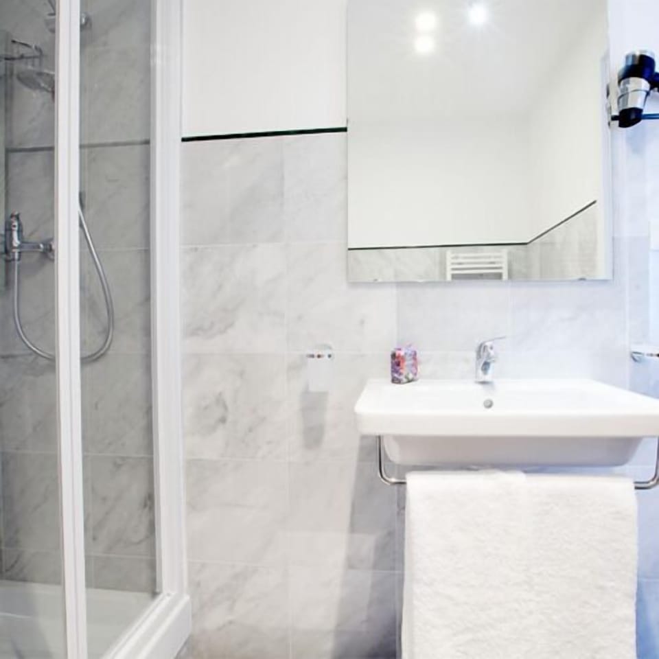 Shower, free toiletries, hair dryer, slippers