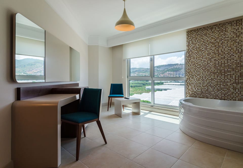 Suite, 2 Bedrooms | Premium bedding, free minibar items, in-room safe, desk