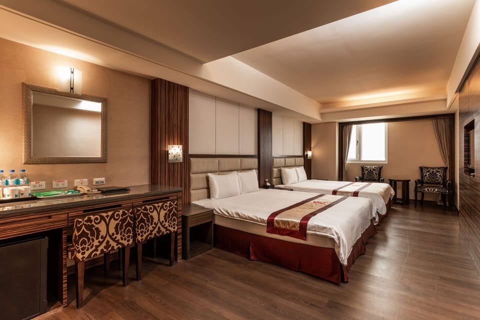 Deluxe Quadruple Room | Premium bedding, desk, laptop workspace, blackout drapes