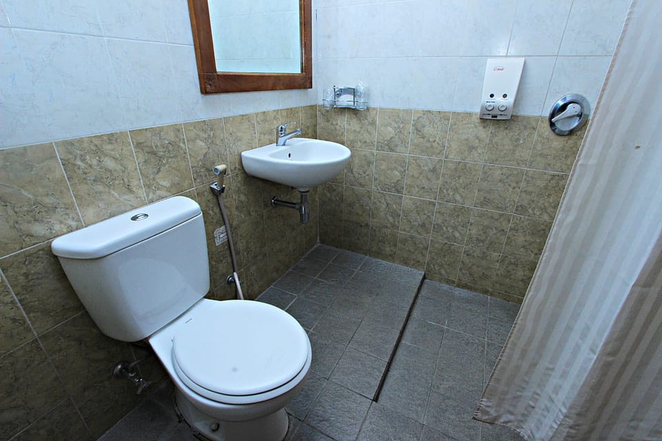 Shower, free toiletries, hair dryer, slippers