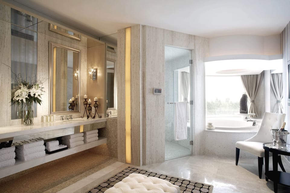 Presidential Suite | Bathroom | Separate tub and shower, rainfall showerhead, hair dryer, bathrobes