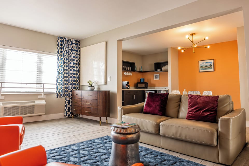One Bedroom Queen Suite with Balcony | Living area | 42-inch plasma TV with cable channels, TV