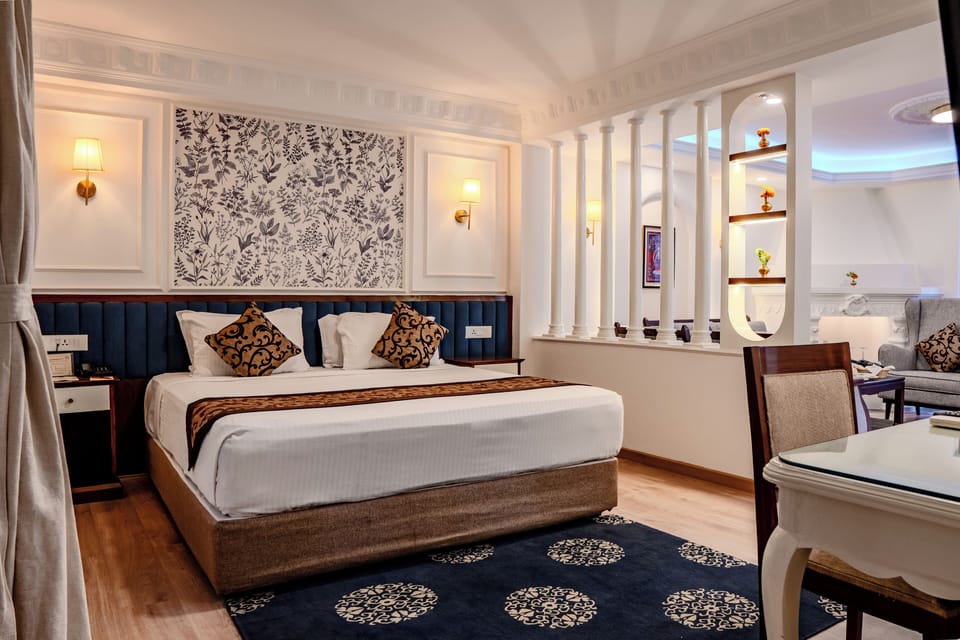 Family Room, 1 Queen Bed, Kitchen, Ground Floor | Minibar, in-room safe, individually decorated, individually furnished