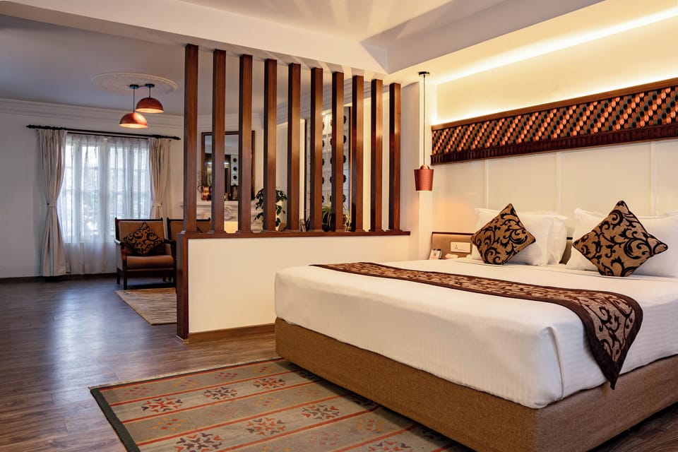 Family Room, 1 Queen Bed, Kitchen, Ground Floor | Minibar, in-room safe, individually decorated, individually furnished
