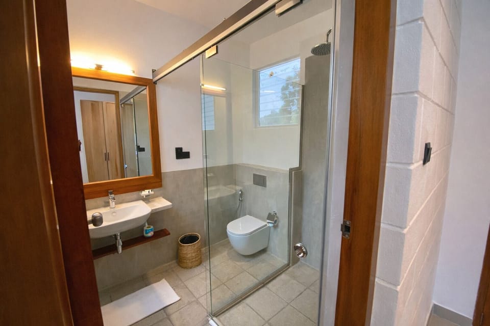 Shower, rainfall showerhead, designer toiletries, hair dryer