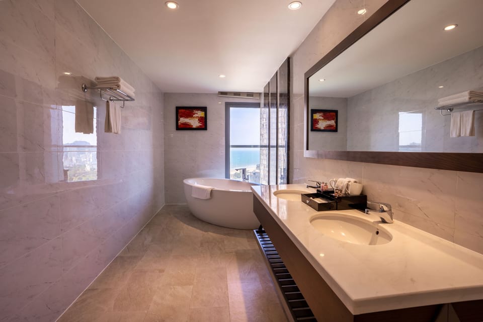 Malibu Suite | Bathroom | Designer toiletries, hair dryer, bathrobes, slippers