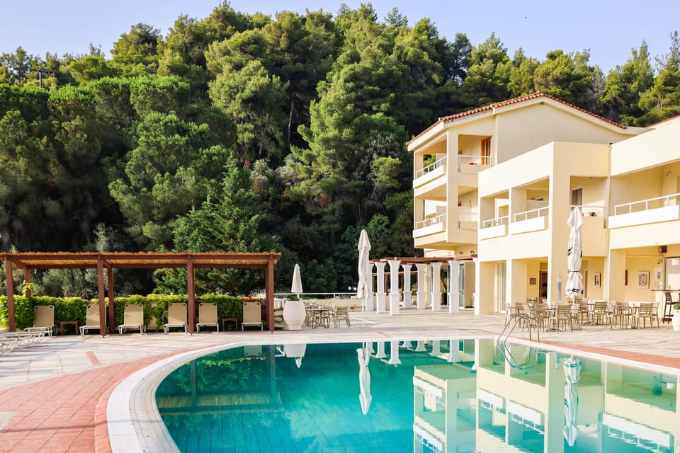 Seasonal outdoor pool, open 9:00 AM to 8:00 PM, pool umbrellas