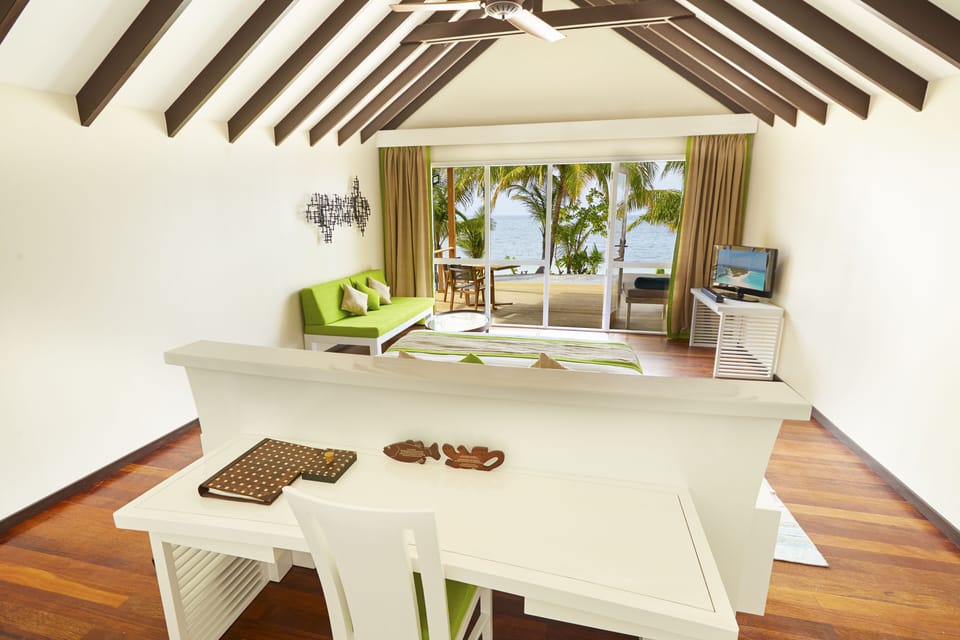 Deluxe Beach Villa | Minibar, in-room safe, desk, free WiFi