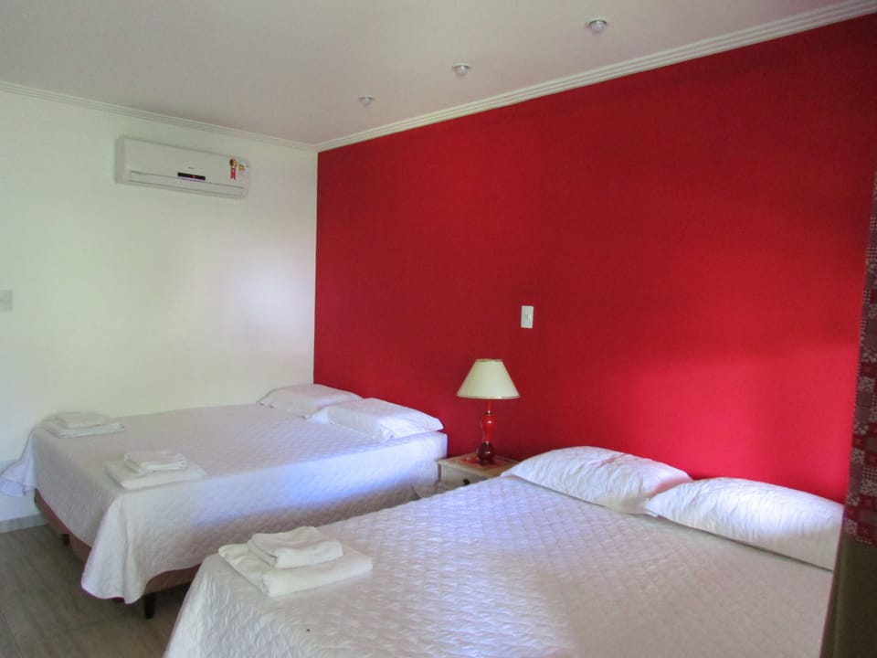 Standard Quadruple Room, Balcony | Minibar, individually decorated, individually furnished, desk