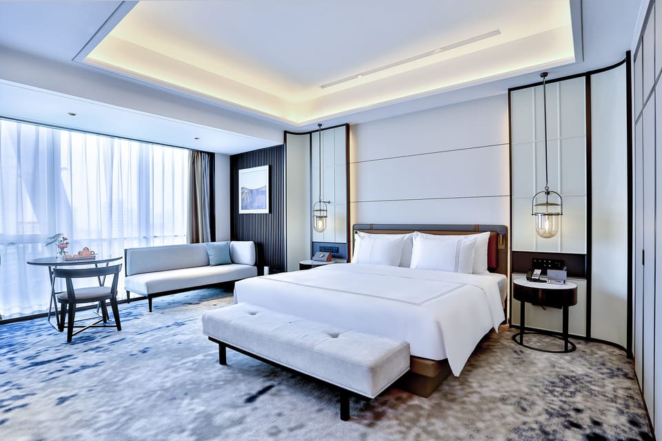 Deluxe Double Room | Minibar, in-room safe, desk, blackout drapes
