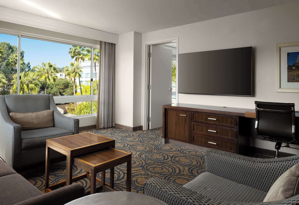 Bedroom King Suite | Living area | 65-inch LCD TV with digital channels, TV, Netflix