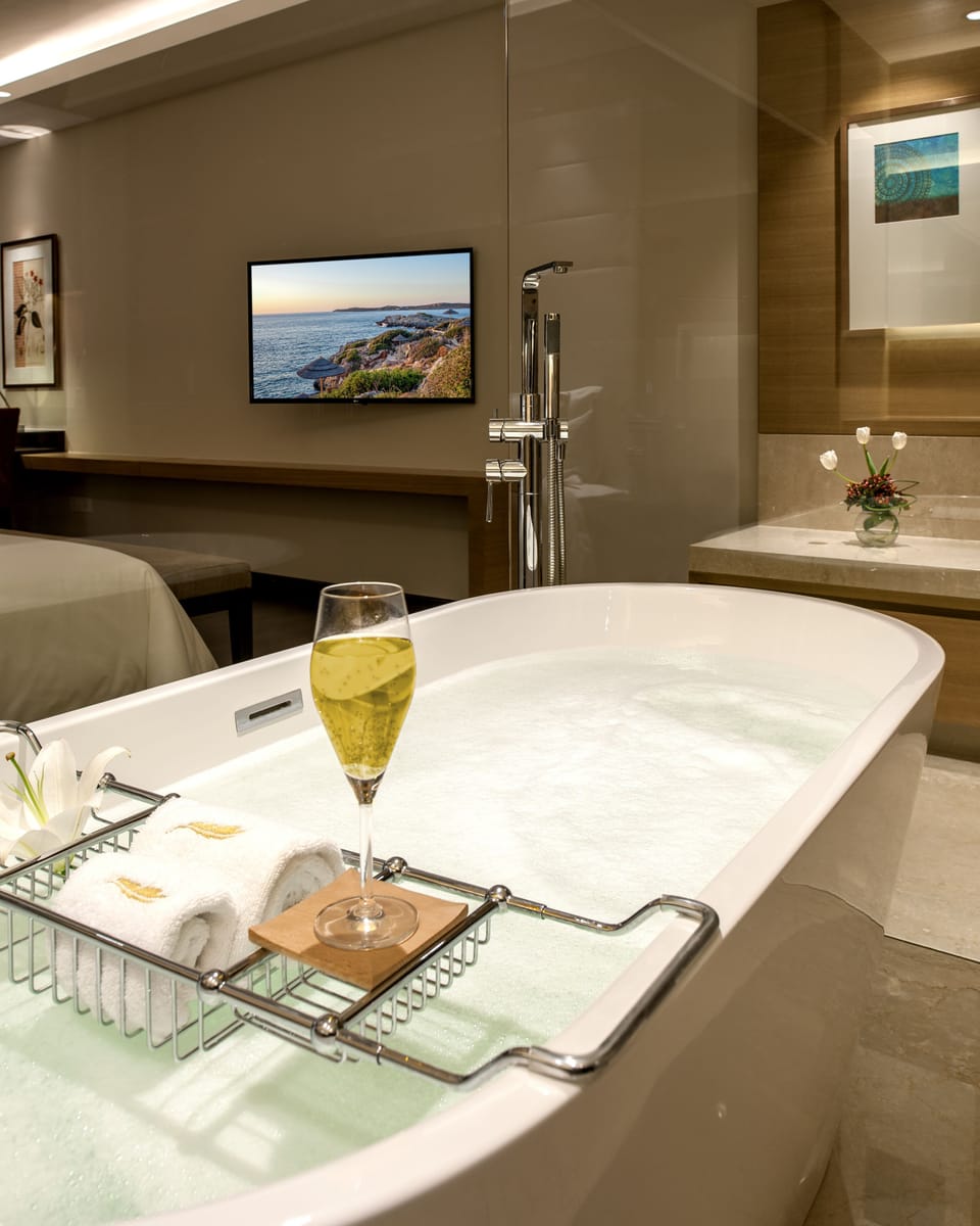 Separate tub and shower, free toiletries, bathrobes, towels