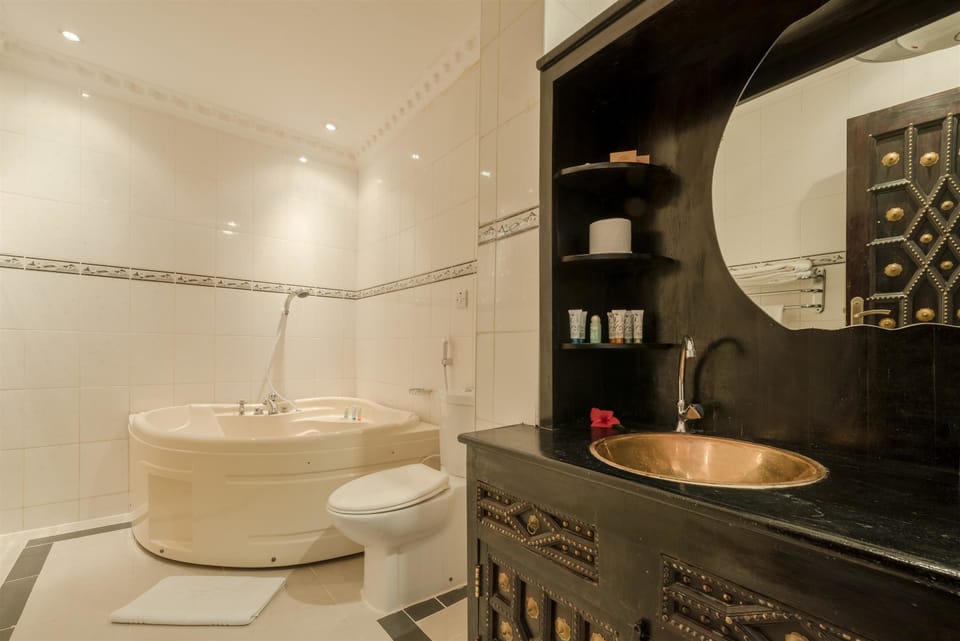 Eco-friendly toiletries, hair dryer, slippers, bidet
