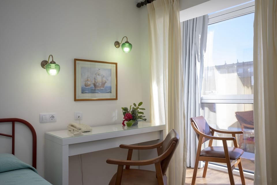 Twin Room | Desk, blackout drapes, cribs/infant beds