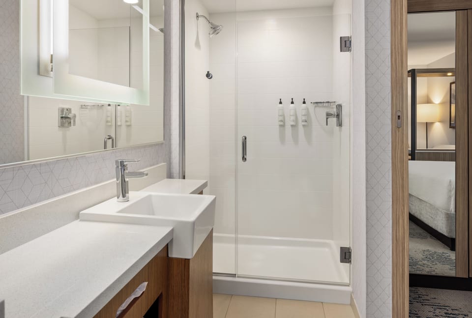 Designer toiletries, hair dryer, towels, soap