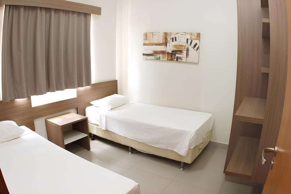 Family Apartment | Minibar, blackout drapes, soundproofing, bed sheets
