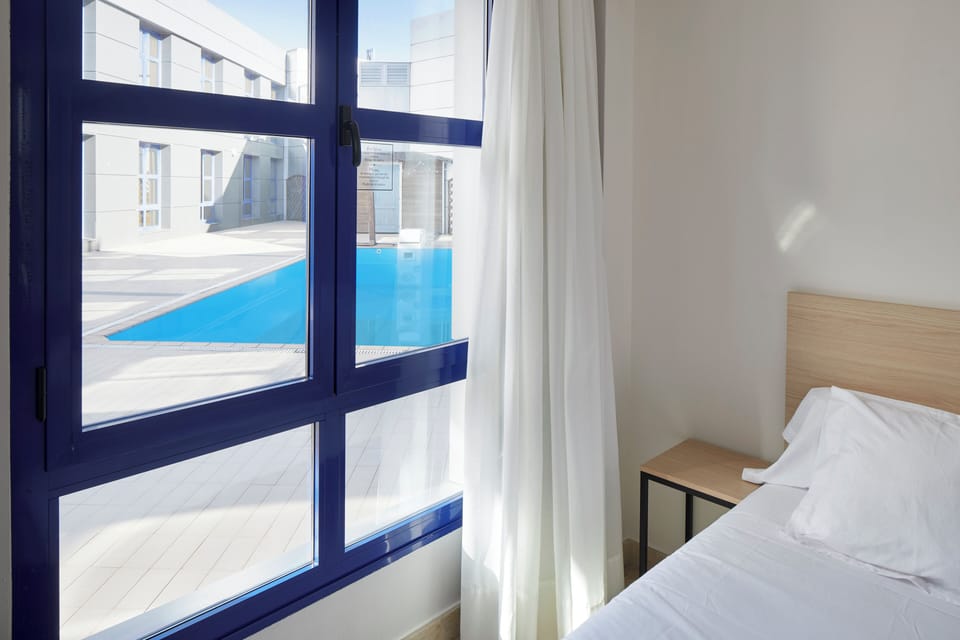 Blackout drapes, soundproofing, free WiFi, bed sheets