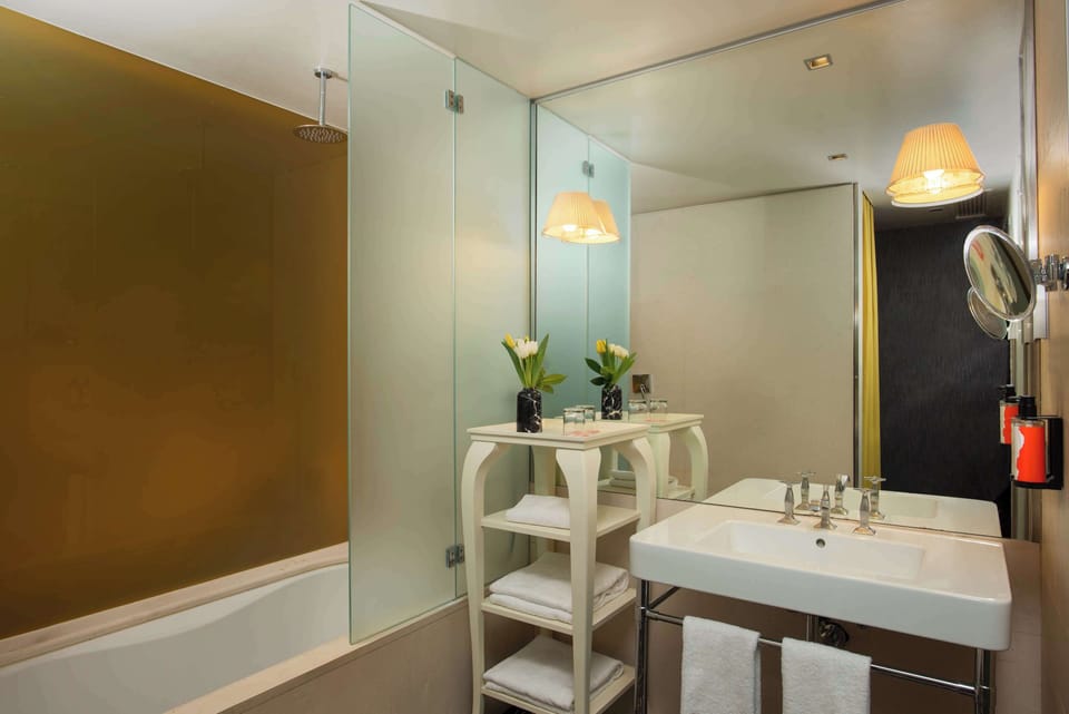 Designer toiletries, hair dryer, bathrobes, bidet
