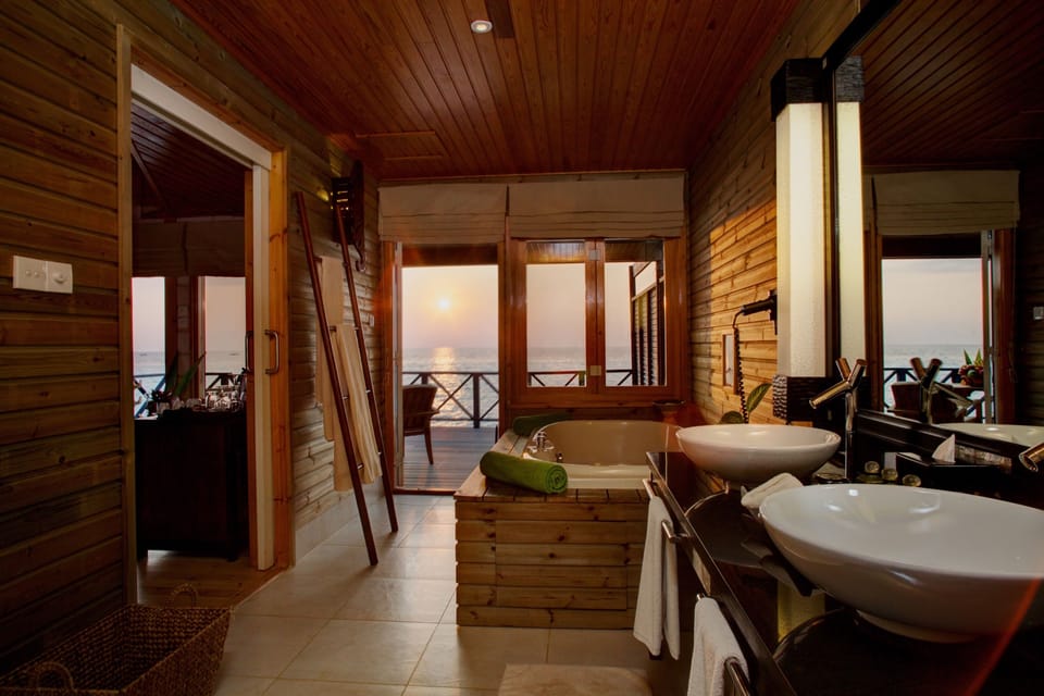 Jacuzzi Water Villa | Bathroom | Shower, free toiletries, hair dryer, bathrobes