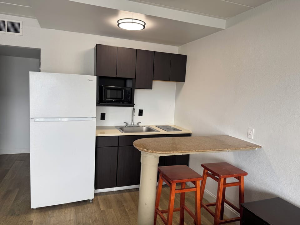 Kind Bed Studio with Kitchenette | 1 King Bed | Private kitchen | Fridge, microwave, stovetop