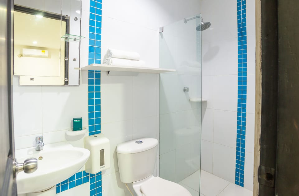 Quadruple Room | Bathroom | Shower, free toiletries, hair dryer (on request)