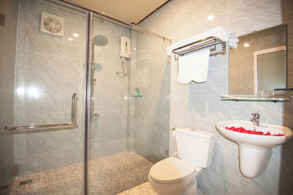 Shower, rainfall showerhead, designer toiletries, hair dryer