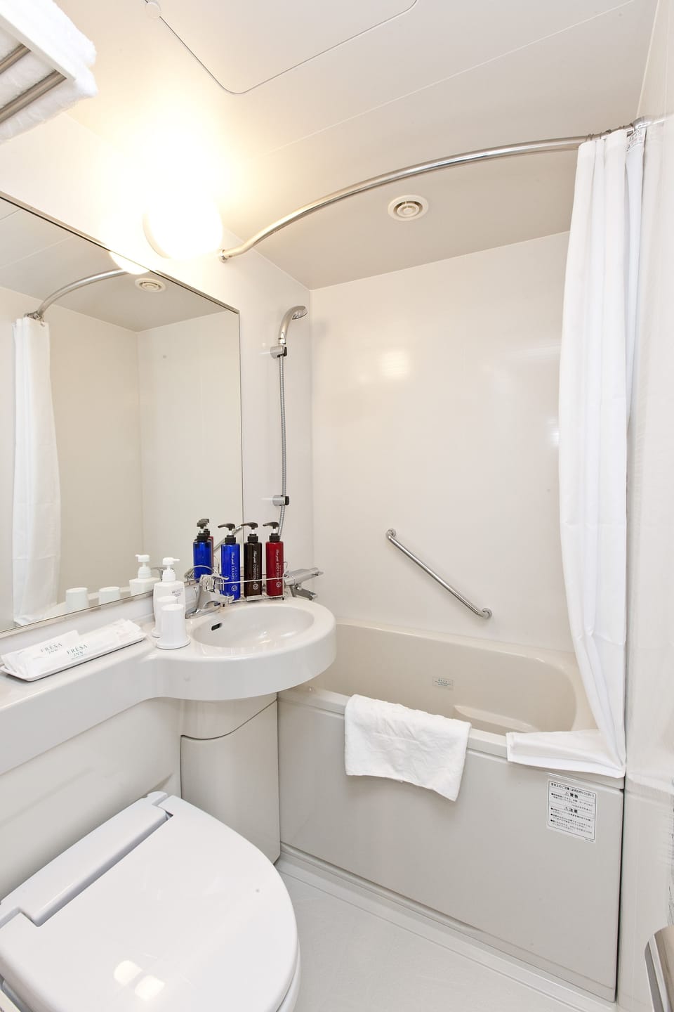 Combined shower/tub, free toiletries, hair dryer, slippers