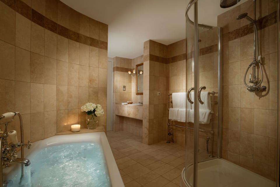 Suite | Bathroom | Designer toiletries, hair dryer, bathrobes, towels