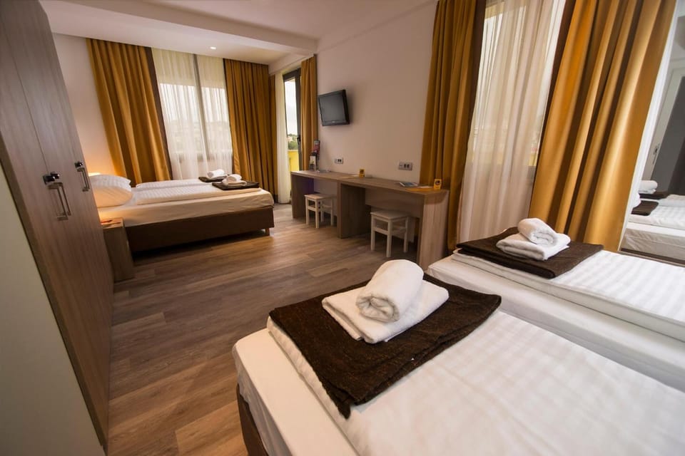 Classic Quadruple Room, Balcony | In-room safe, free WiFi, bed sheets