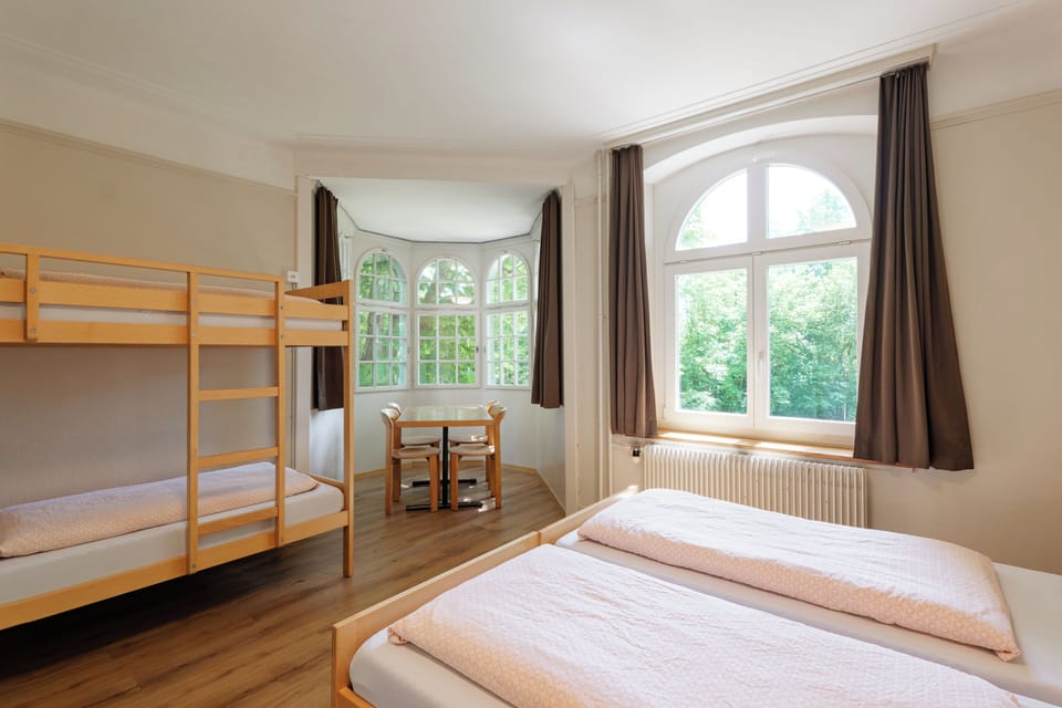 Family Room | Desk, bed sheets