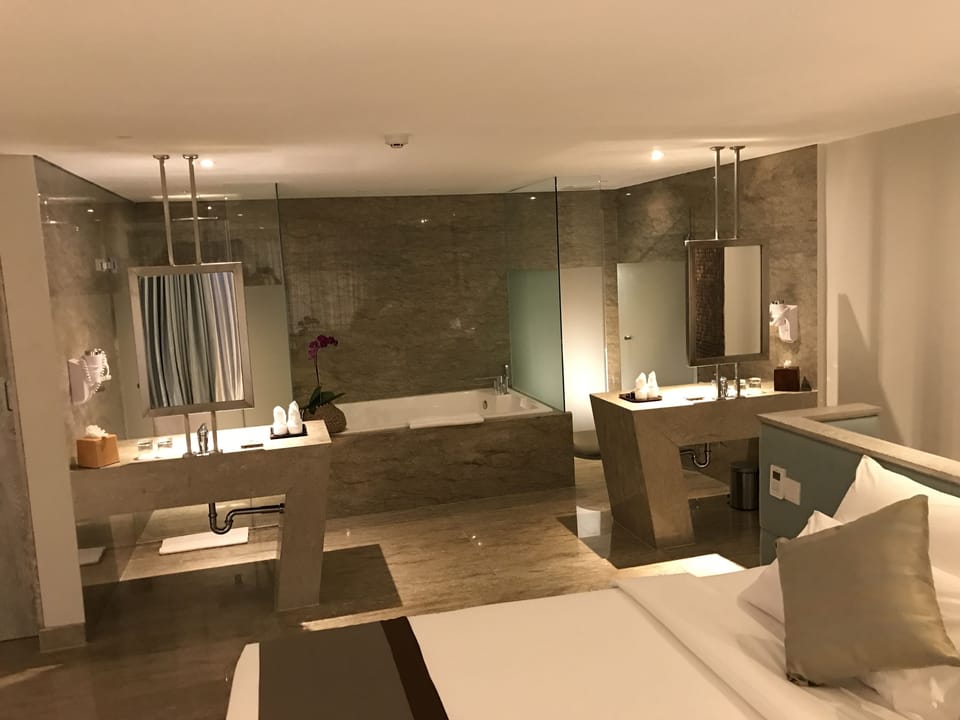 Suite, 1 King Bed, City View | Bathroom | Free toiletries, hair dryer, slippers, towels