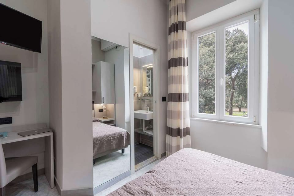 Economy Double Room | 1 bedroom, premium bedding, minibar, in-room safe